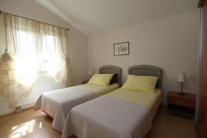 Posteľ alebo postele v izbe v ubytovaní Apartments Salona