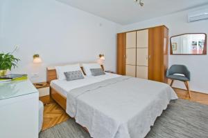 Postel nebo postele na pokoji v ubytování Hvar Deluxe Rooms + 19 fotografií