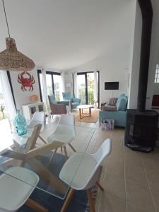 a living room with a glass table and chairs at Chaguimama Sea in Begur +15 photos