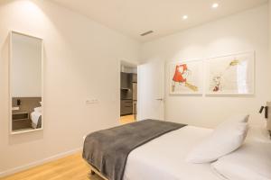 Mon Suites Jardín de Ayora客房内的一张或多张床位