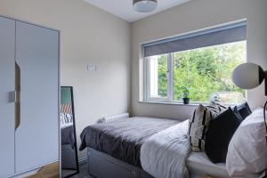 a bedroom with a bed and a window at Stay @ London Road Derby in Derby