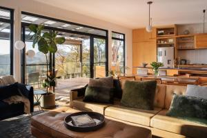 a living room with a couch and a table at Fig Place Wonderful Vista in Lindisfarne