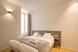 Mon Suites Jardín de Ayora客房内的一张或多张床位