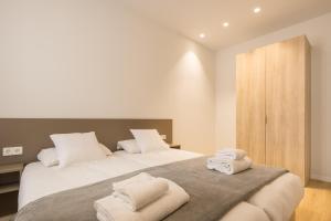 Mon Suites Jardín de Ayora客房内的一张或多张床位