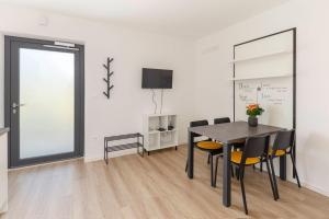 a dining room with a table and chairs at Apartma Lajf in Brežice
