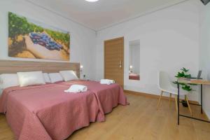 Postel nebo postele na pokoji v ubytování CINCO VILLAS
