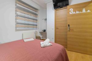 Postel nebo postele na pokoji v ubytování CINCO VILLAS