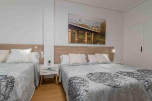 Postel nebo postele na pokoji v ubytování CINCO VILLAS