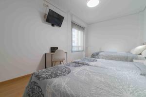 Postel nebo postele na pokoji v ubytování CINCO VILLAS