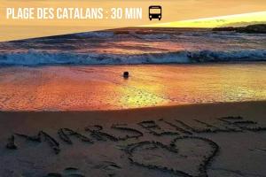 a message written in the sand on the beach at Grand Loft Lumineux - Gare St Charles 10 MIN in Marseille