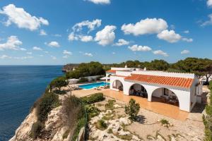 a villa with a view of the ocean at Villa Panorama in Cala'n Porter
