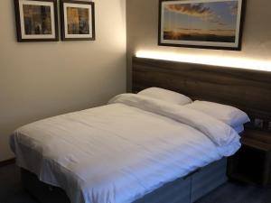 Llit o llits en una habitació de Rivington Lodge