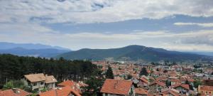 a view of a city with houses and mountains at Къща за гости Сара in Velingrad
