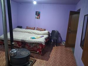 Postel nebo postele na pokoji v ubytování Shiva Homestay