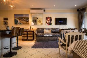 a living room with a couch and a table at 515 Umdloti Resort in Umdloti