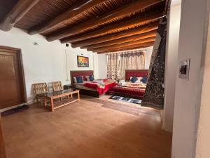 a living room with a couch and a table at Olgok Guest House Nubra in Hundar