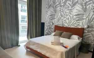 Postel nebo postele na pokoji v ubytování Mandarin Apulia 19 B&B