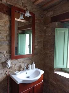 a bathroom with a sink and a mirror at Villa Incanto in Apiro