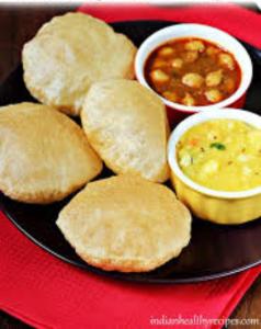 a plate of food with biscuits and soup on a red tray at Hotel Padoshi Puri Near Sea Beach & Temple - Parking Facilities - Best Hotel in Puri in Puri