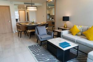 a living room with a couch and a dining room at Lonsdale House Luxury Apartments in Ulverston