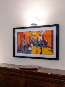 a picture of a painting on a wall at Casa Misette 200mq a due passi dal mare in Alassio
