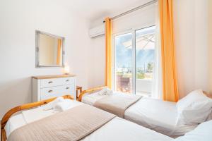 Ένα ή περισσότερα κρεβάτια σε δωμάτιο στο Ilia's Apartment with view 2