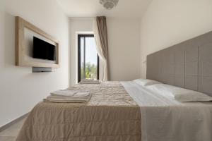 Ένα ή περισσότερα κρεβάτια σε δωμάτιο στο Tenuta Vigna Corallo - Mimosa +17 φωτογραφίες