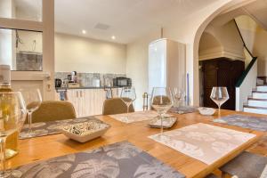 a dining room with a wooden table with wine glasses at Casa en Finca Rustica in Jijona
