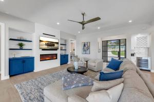 a living room with a couch and a fireplace at The Captain's Cove at 110 in Horseshoe Bay +41 photos
