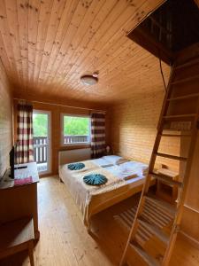 Postel nebo postele na pokoji v ubytování Hotel Pod Sokolím