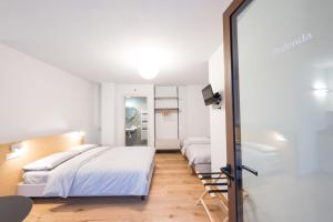 Postel nebo postele na pokoji v ubytování Agriturismo Grion