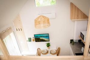 a dining room with a table and chairs at La Maisonnette Marloise in Marles-en-Brie