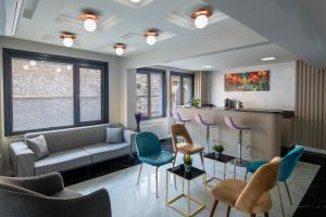 a living room with a couch and chairs at İstanbul Efes Hotel in Istanbul