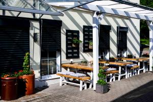 a group of tables and chairs in a building at Stadtplatz23 B&B in Bogen