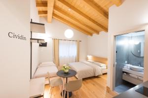 Postel nebo postele na pokoji v ubytování Agriturismo Grion
