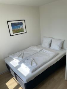 Postel nebo postele na pokoji v ubytování Marsk Hotel Apartments 6B, 1-TH