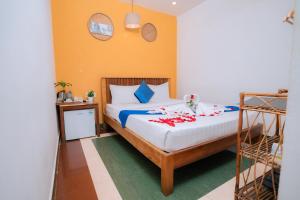 Postel nebo postele na pokoji v ubytování Grand Elevation Hotel