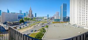 a view of a city with a street and buildings at Marszałkowska Apartments Studio Central Warsaw in Warsaw