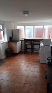 a large room with a table and a kitchen at One Bedroom Flat with on premises parking in Walsall +2 photos