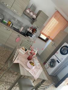 a kitchen with a table with two plates of food on it at Casa Vacanza Orto dei Preti in Collepardo