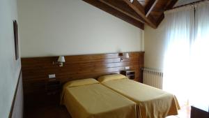 Un pat sau paturi într-o cameră la Hotel Pla del Pi