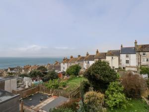 a view of a town with houses and the ocean at Fisherman's Cottage, King Street in Portland
