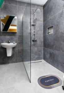 a bathroom with a shower and a sink at Green Center Gili in Gostivar