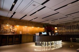 a lobby of a restaurant with a counter and a bar at City Suites - Beimen in Taipei