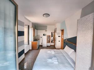 A bed or beds in a room at Residence Corallo