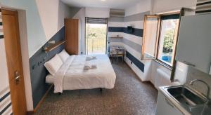 A bed or beds in a room at Residence Corallo