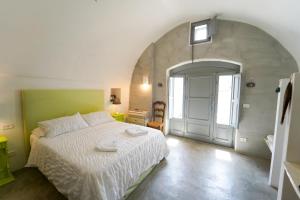 Postel nebo postele na pokoji v ubytování Villa Pesce