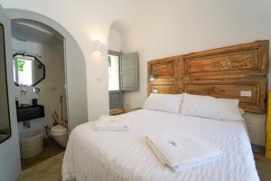 Postel nebo postele na pokoji v ubytování Villa Pesce