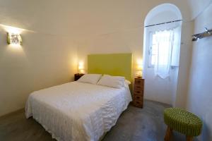 Postel nebo postele na pokoji v ubytování Villa Pesce