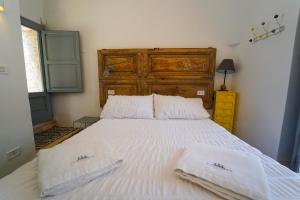 Postel nebo postele na pokoji v ubytování Villa Pesce